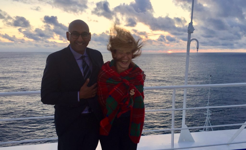 Merry Lerner, founder of travel and lifestyle blog, Let's Be Merry, on the deck of a cruise ship with her husband Prash Srinivasan