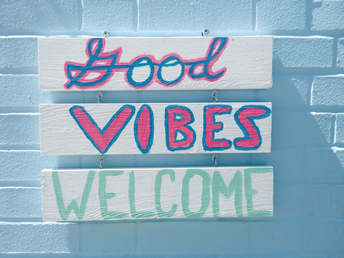 Good Vibes Welcome sign captures essence of lifestyle and travel blog let's be merry