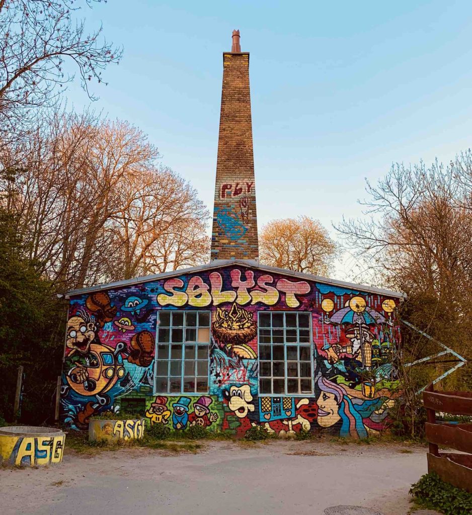 a-building-in-freetown-christiania-copenhagen-covered-in-street-art