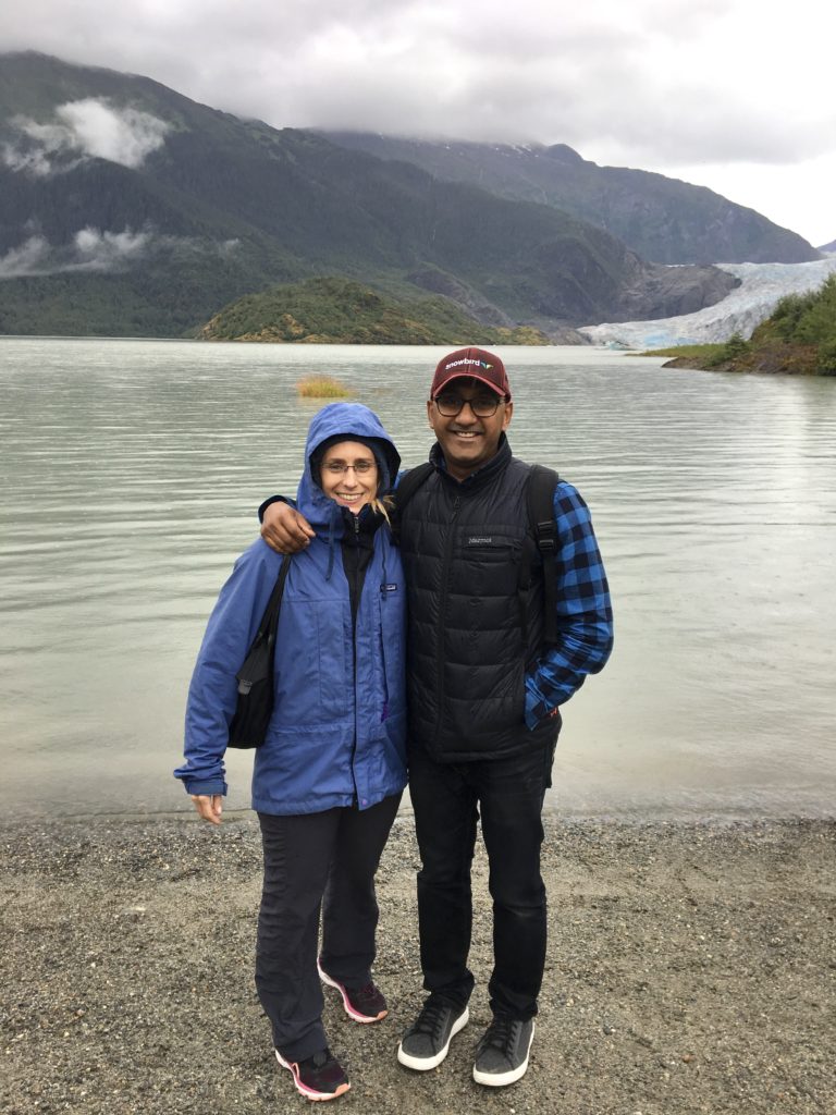 merry and prash in front of Mendenhall Glacier in Juneau Alaska