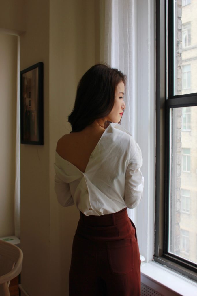 Jinhye shows us wardrobe essentials with a white button down styled backwards and off the shoulder