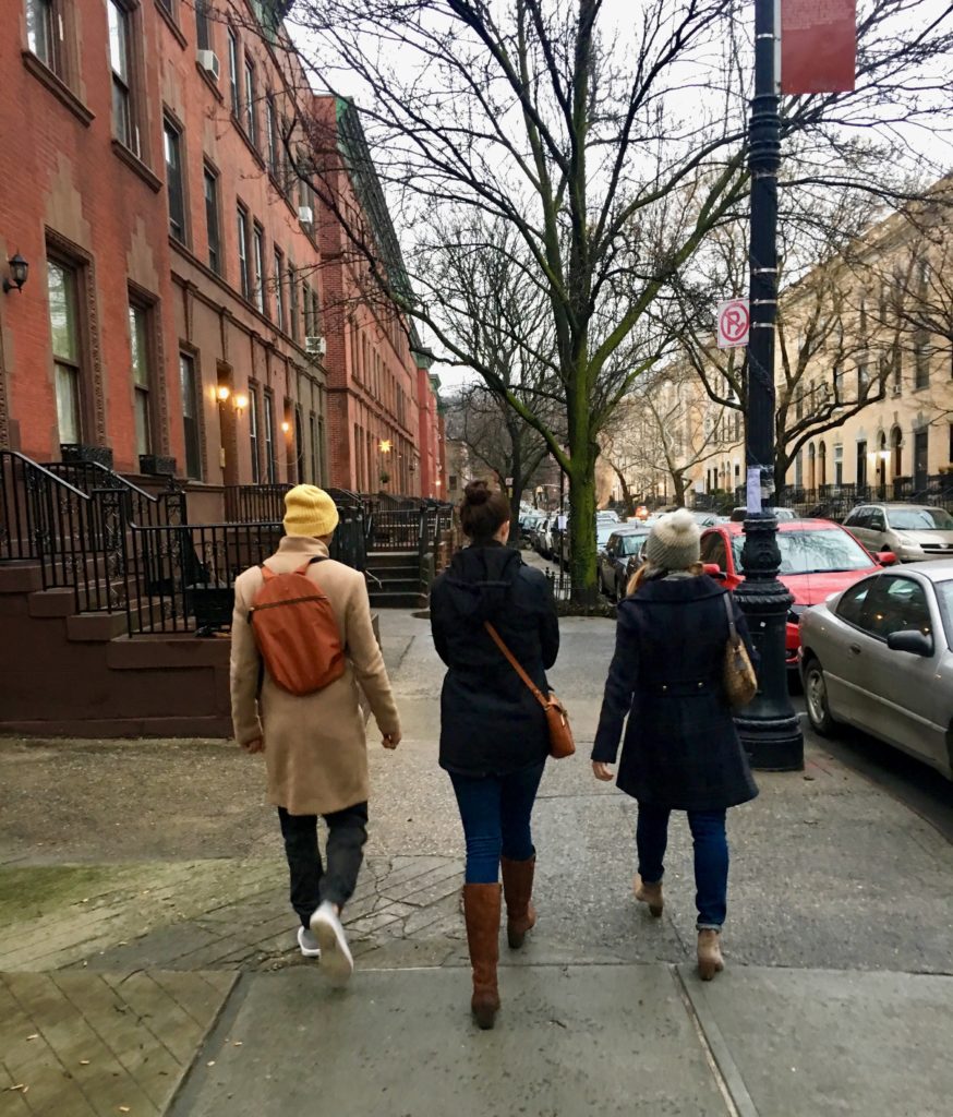 Merry Lerner strolling with friends on Strivers Row in Harlem