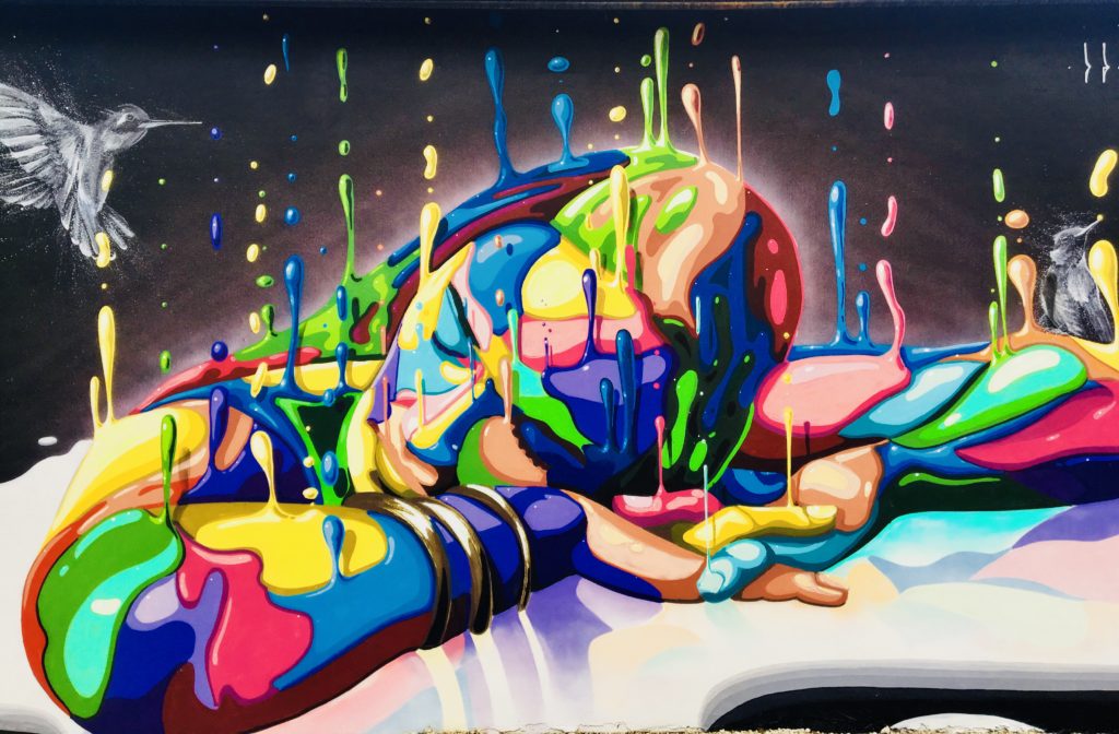 a colorful mural at Wynwood Walls