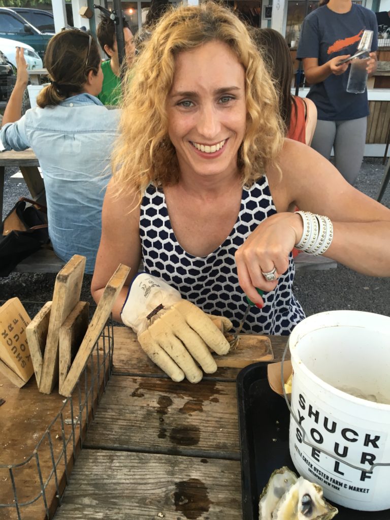 Shucking oysters at Little Creek Oyster Farm on the North Fork