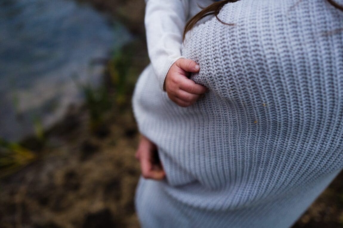 a woman holding a baby