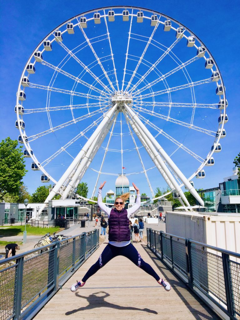 Merry lerner jumping for joy in front of La Grand Roue in Montreal