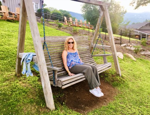 Merry lerner sitting on a wooden swing