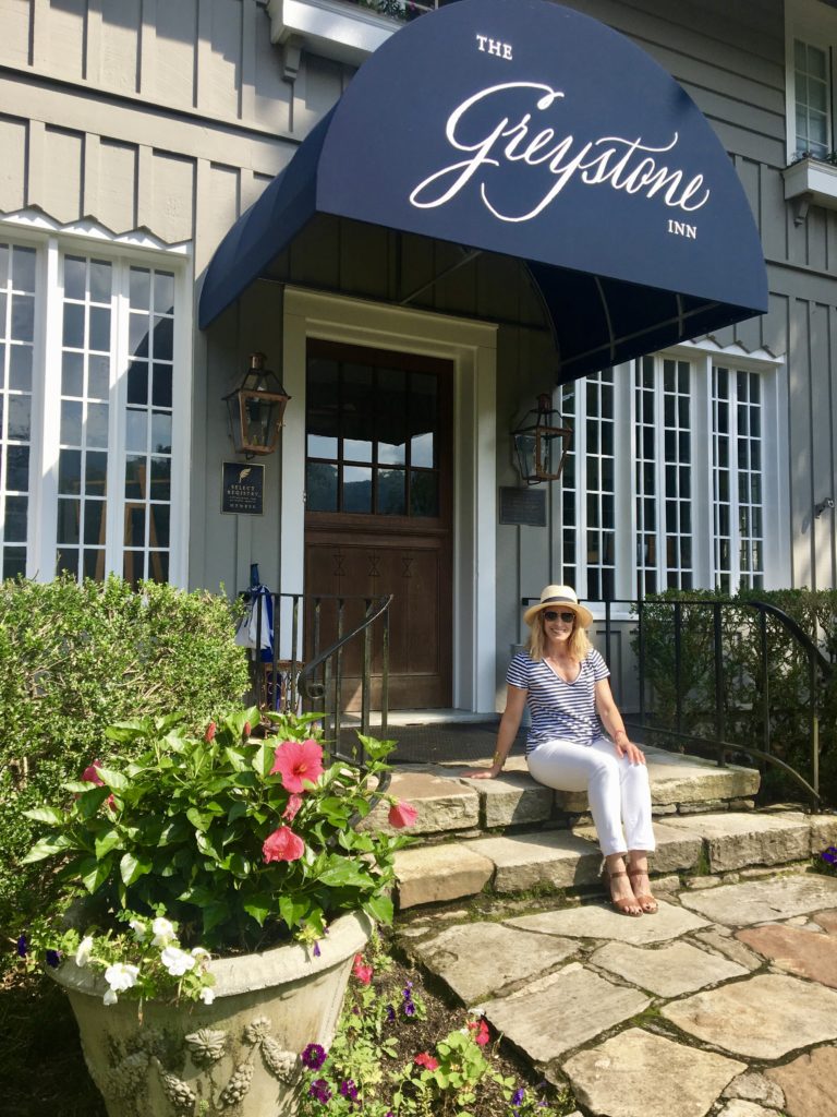 Merry Lerner in front of The Greystone Inn on Lake Toxaway