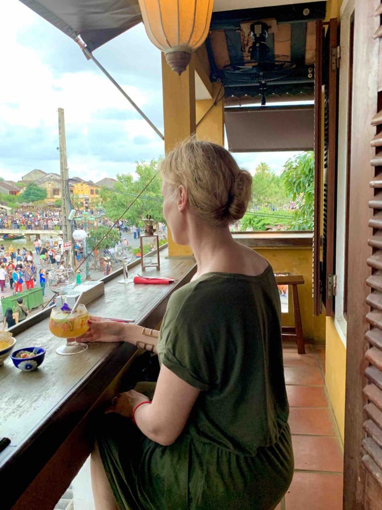 enjoying-a-sunset-cocktail-from-the-second-floor-balcony-mango-mango-hoi-an-vietnam