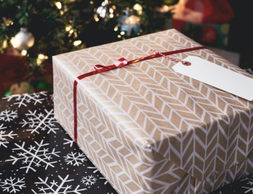 holiday-gifts-under-fifty-dollars-nicely-wrapped-present-by-christmas-tree