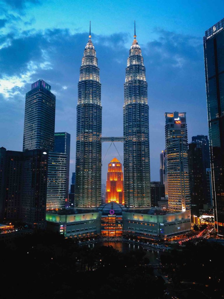 a-view-of-the-petronas-towers-at-dusk