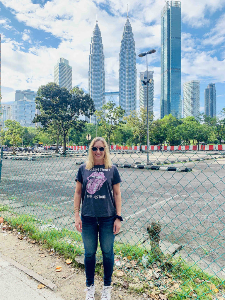 merry-with-the-petronas-towers-behinc-her