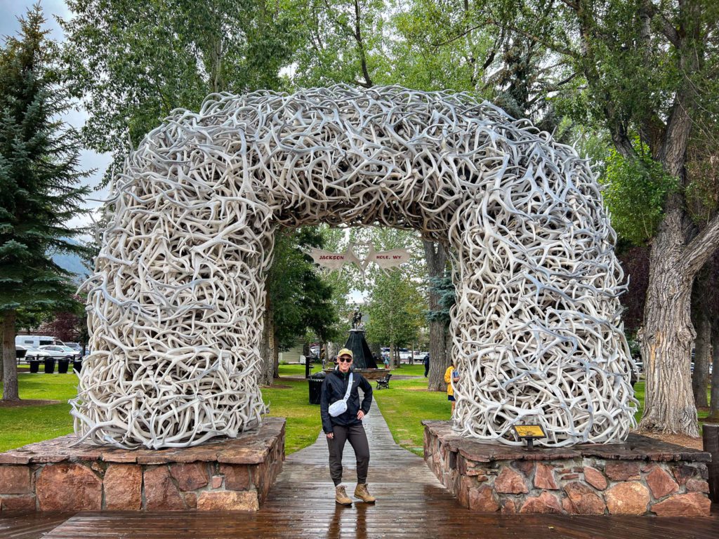 merry-standing-by-famous-antler-horns-jackson-wyoming-town-square